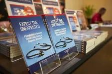A spread of Expect the Unexpected by Prof Datin Dr Chia Yook Chin and Dr Ng Wei Leik on display during the book launch