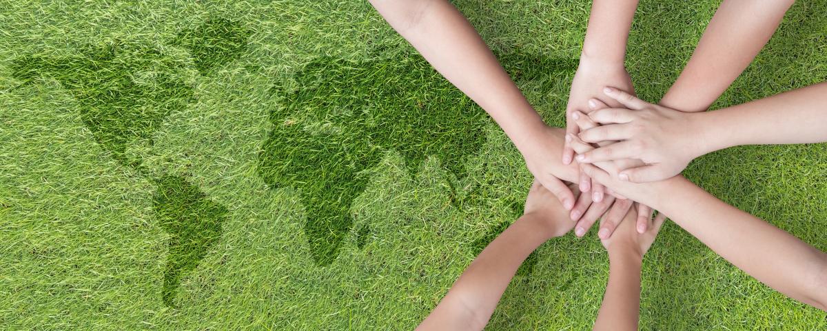 hands in partnership against green background